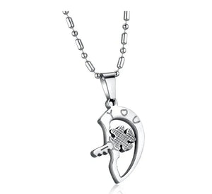 Silver necklace with heart-shaped pendant, key and clover design, engraved 'YOU'