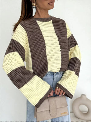 Color block long sleeve sweater in brown and cream stripes, worn with light jeans and a beige clutch — Rberyl