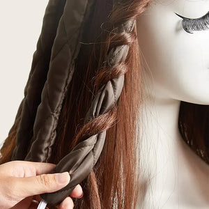 Heatless curling rod headband used to curl brown hair on a mannequin head