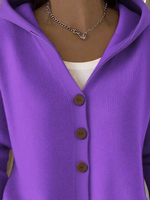 Purple button-up knit cardigan with hoodie, worn over white top and chain necklace