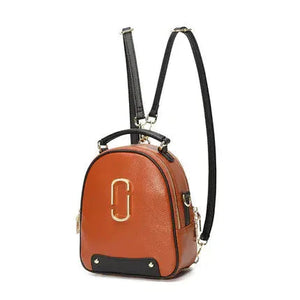 Small brown leather backpack with gold hardware and black adjustable straps
