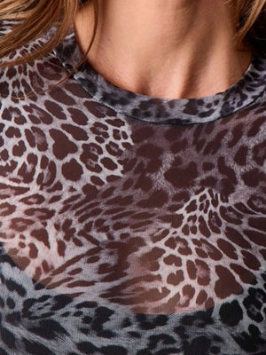 Close-up of sheer animal print mesh top with brown and black leopard pattern