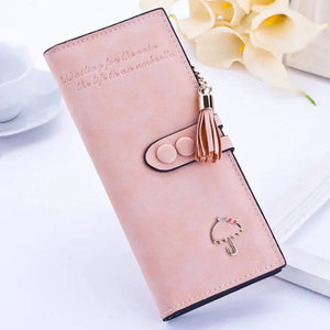 Light pink women's wallet with tassel charm and umbrella decor on white background