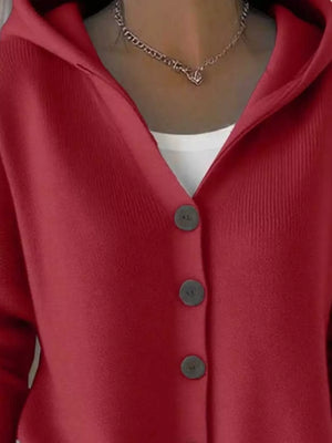 Red button-up cardigan with hood, layered over a white top, and silver chain necklace
