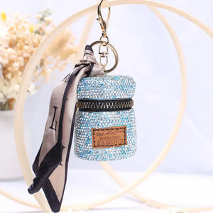 Sparkly blue rhinestone mini bag keychain with silk scarf and gold clasp, stylish accessory