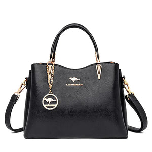 Black leather handbag with gold hardware, kangaroo logo and detachable shoulder strap