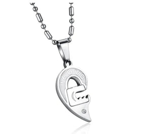 Silver heart-shaped pendant necklace with 'I LOVE' engraving and gemstone detail