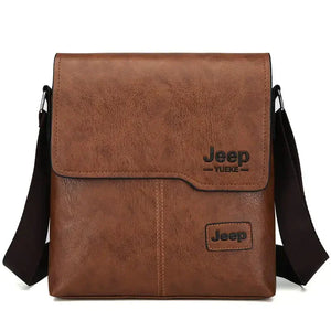 Brown leather crossbody messenger bag with black 'Jeep' logo and adjustable strap