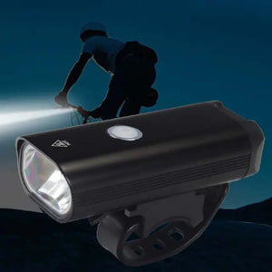 LED bicycle headlight with mounting strap, cyclist riding at night in background
