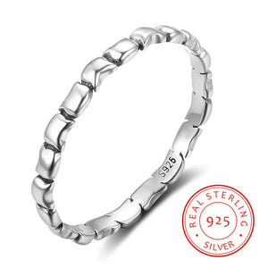 Textured 925 sterling silver stacking ring with a modern geometric link design