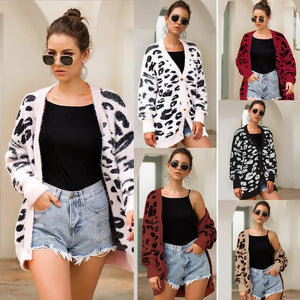 Woman modeling leopard print cardigan in different colors with black top and denim shorts