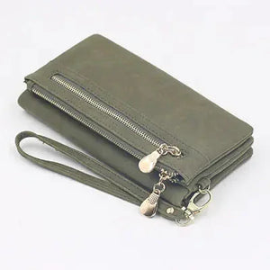 Olive green women’s wallet with zipper, wrist strap, and multiple compartments on white background