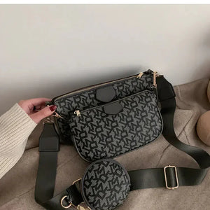 Stylish black and gray patterned crossbody bag set with gold hardware and wide strap
