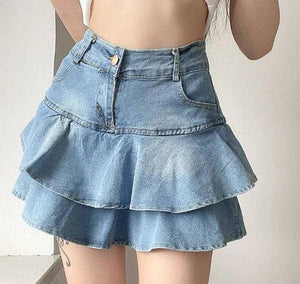 Light blue tiered denim mini skirt with high waist, modeled indoors
