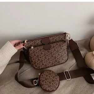 Brown patterned crossbody bag with matching coin pouch and adjustable strap on beige fabric