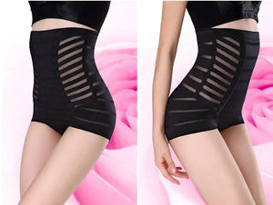 Black high-waisted slimming shapewear shorts with striped mesh panels on a female model
