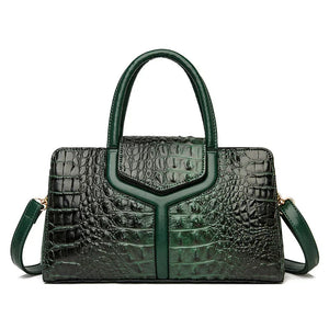 Green crocodile pattern leather handbag with top handles and shoulder strap