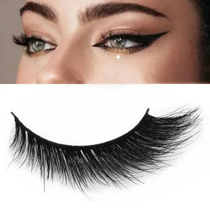 Dramatic false eyelashes on model with cat eye makeup, close-up beauty product image.