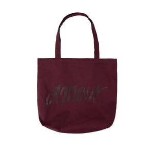 Burgundy canvas tote bag with 'amour' text print and two shoulder straps