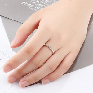 Silver beaded ring on hand, minimalist jewelry, delicate fashion accessory