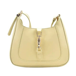 Cream leather shoulder bag with gold-tone clasp and adjustable strap, minimalist style