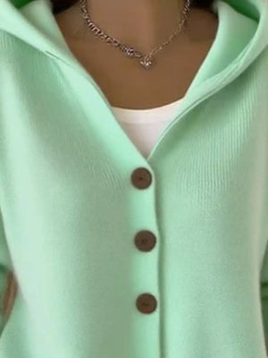 Mint green button-up cardigan with hood, white top underneath, and chain necklace