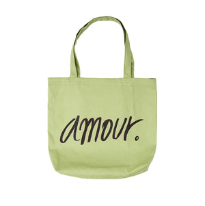 Light green canvas tote bag with 'amour.' text in black, eco-friendly fashion accessory