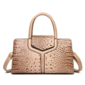 Beige crocodile-embossed handbag with top handles and detachable shoulder strap