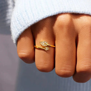 Gold adjustable leaf ring with small diamonds on hand, minimal jewelry style
