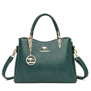 Dark green leather handbag with gold hardware, top handles, detachable shoulder strap, and kangaroo logo charm