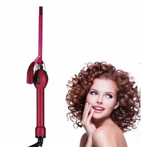 Red curling iron next to woman with voluminous curly hair on white background