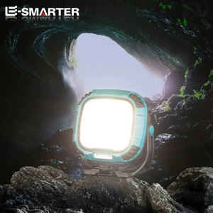 Bright LED lantern illuminating a rocky cave entrance, portable outdoor lighting