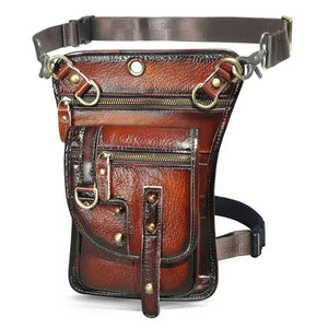 Brown leather utility belt bag with zippers, metal rings, and adjustable straps
