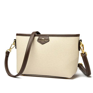 Beige and brown leather crossbody bag with gold hardware and detachable strap