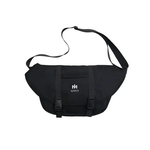 Black messenger bag with adjustable strap and front buckle closure, minimalist design