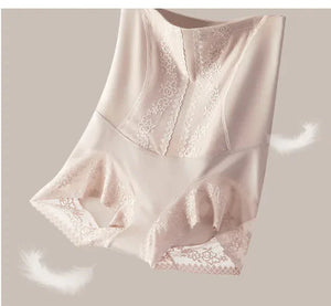 High-waisted nude lace shapewear shorts with floral details on a neutral background.