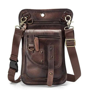 Brown leather crossbody bag with front pocket, zipper, adjustable strap, and metal hardware