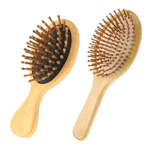 Two wooden hair brushes with natural bristles on white background