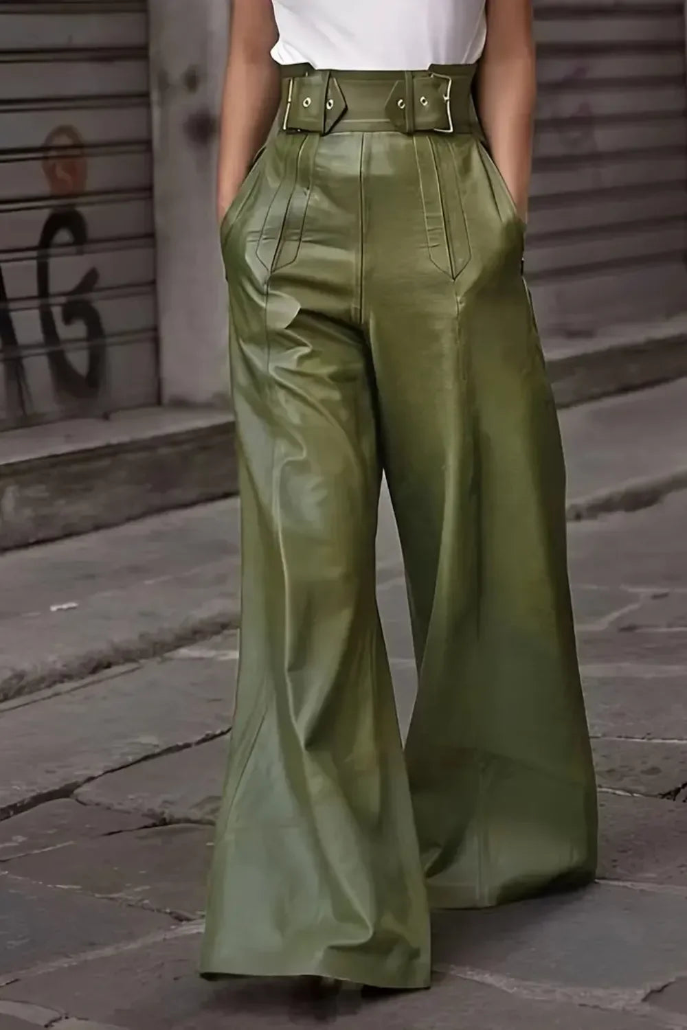 High-waisted green wide-leg faux leather pants with belt details, street style fashion