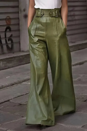 High-waisted green wide-leg faux leather pants with belt details, street style fashion