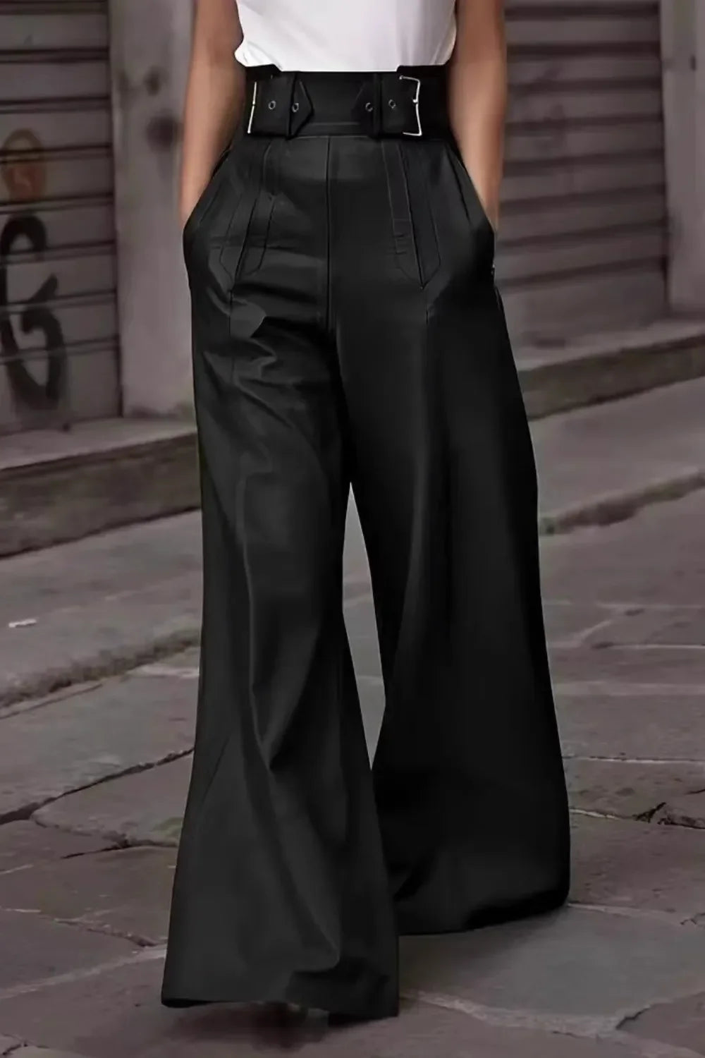 High-waisted black wide-leg pants with belt details, street style fashion