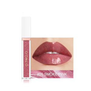 Glossy smoke pink liquid lipstick with gold shimmer, close-up on lips and product tube