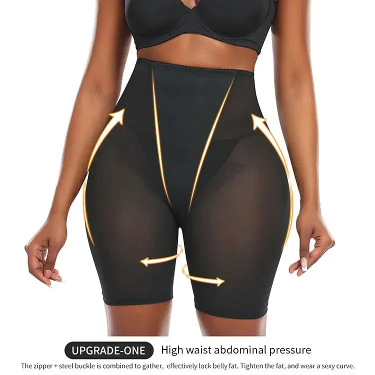 Woman wearing high-waisted black shapewear shorts with compression and slimming arrows