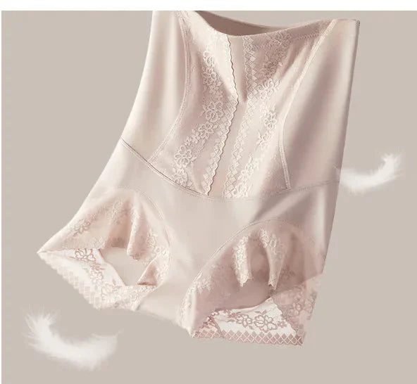 High-waisted nude lace shapewear shorts with floral details on a neutral background.